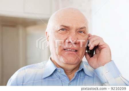 handsome mature man speaking by phone 9210209