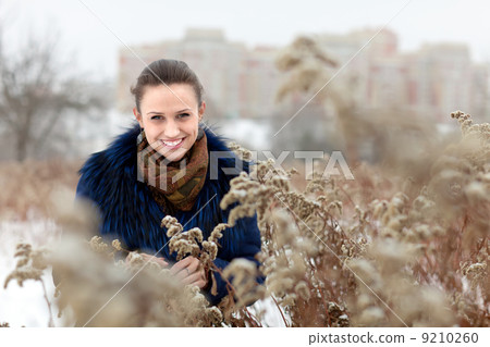smiling gir at wintry park 9210260