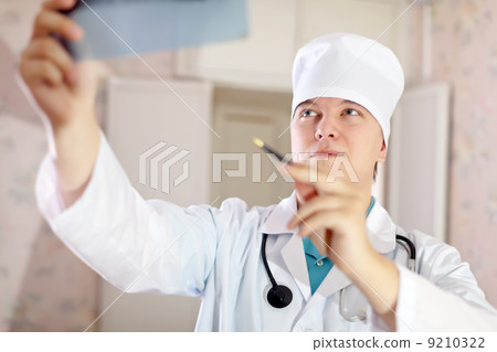 Doctor looking an x-ray Doctor looking an x-ray 9210322