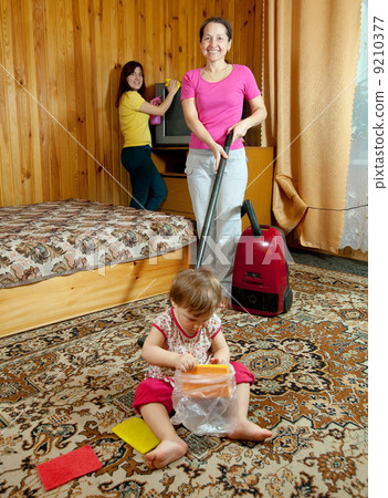 Family cleans in living room Family cleans in living room 9210377