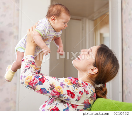 Happy mother holds to baby Happy mother holds to baby 9210432