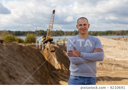 worker at sand pit worker at sand pit 9210691