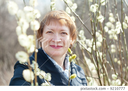 woman in spring willow twig with buds 9210777
