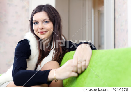 joyful long-haired woman in home 9210778