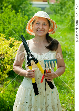 gardener in with garden tools 9211525
