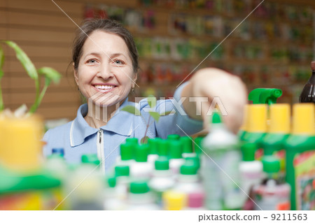 mature gardener chooses liquid fertilizer mature gardener chooses liquid fertilizer 9211563