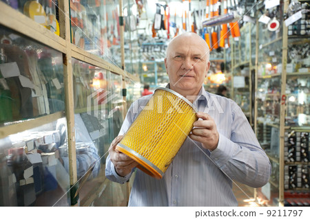 mature man in auto parts store 9211797