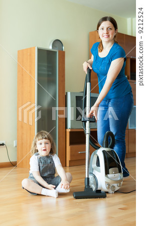 Family is cleans living room 9212524