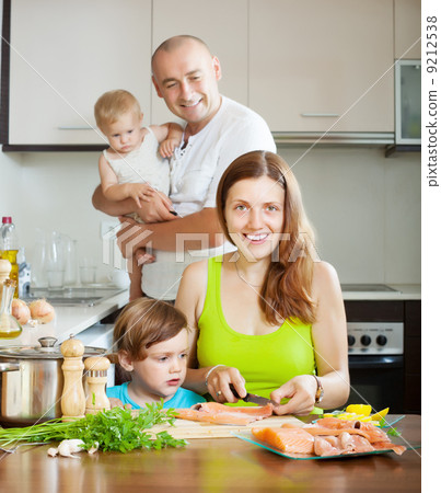 family of four cooking salmon family of four cooking salmon 9212538