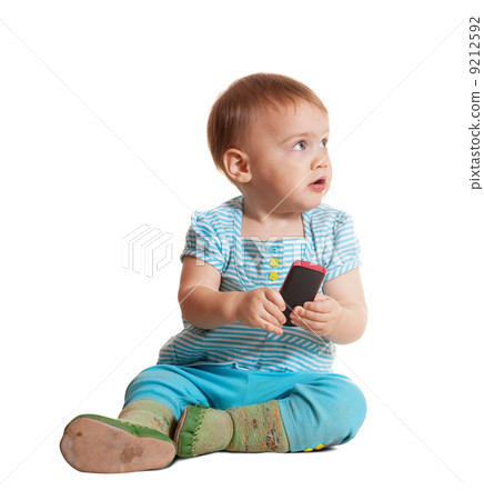 Toddler using mobile phone Toddler using mobile phone 9212592