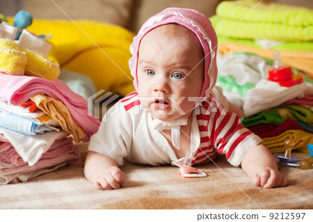 baby with children's clothes baby with children's clothes 9212597