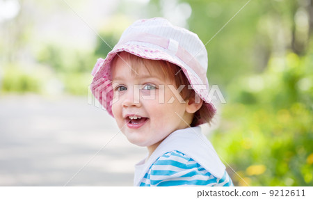 Outdoor portrait of two-year girl 9212611