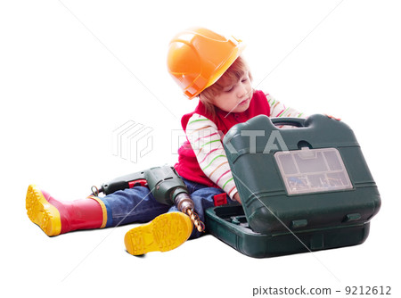 child in hardhat chooses tools in toolbox child in hardhat chooses tools in toolbox 9212612
