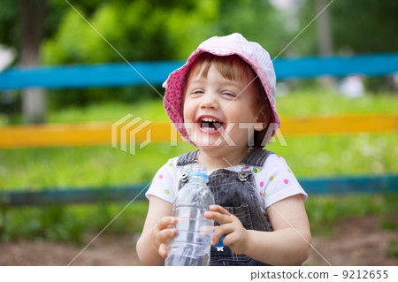 Happy 2 years baby drinks from bottle Happy 2 years baby drinks from bottle 9212655