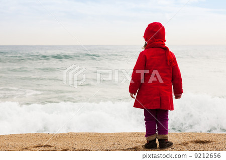 Baby girl in cold windy day 9212656