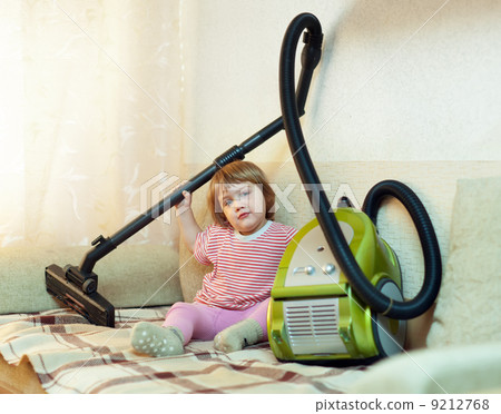 Baby girl with vacuum cleaner Baby girl with vacuum cleaner 9212768