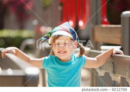 laughing three-year girl at playground area laughing three-year girl at playground area 9212789
