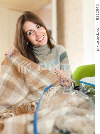 Happy woman with new plaid Happy woman with new plaid 9212946