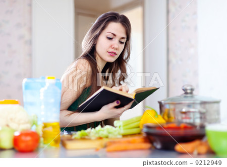 beautiful housewife cooking with cookbook beautiful housewife cooking with cookbook 9212949