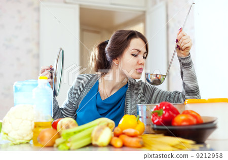 young woman tests food young woman tests food 9212958