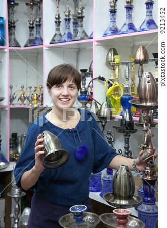 Woman chooses sheesha in egyptian shop Woman chooses sheesha in egyptian shop 9213452