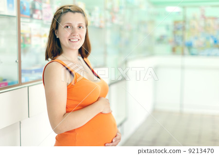 pregnant woman at the pharmacy 9213470