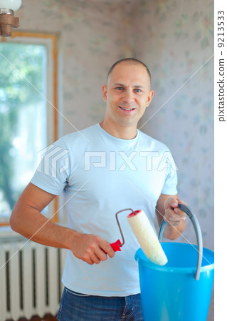 man with paint roller 9213533