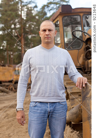 tractor operator at workplace 9213648