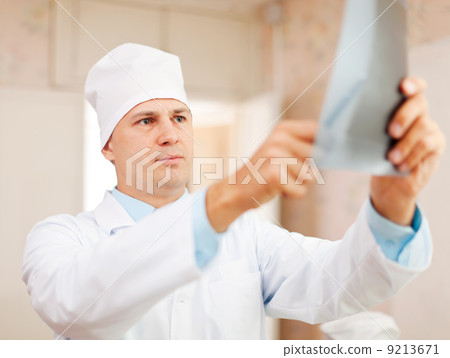 Doctor looking an x-ray Doctor looking an x-ray 9213671