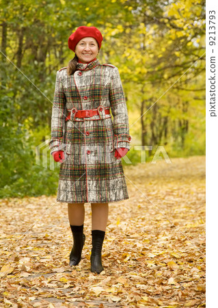 elderly woman walking in autumn elderly woman walking in autumn 9213793