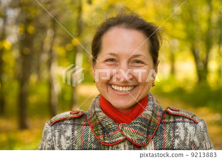 mature woman in autumn park 9213883