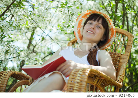 young woman relaxing in blossoming garden 9214065