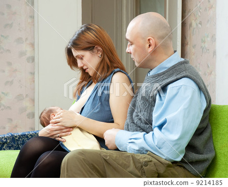 Mother breast feeding newborn baby 9214185