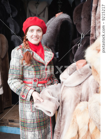 Woman chooses fur coat Woman chooses fur coat 9215217