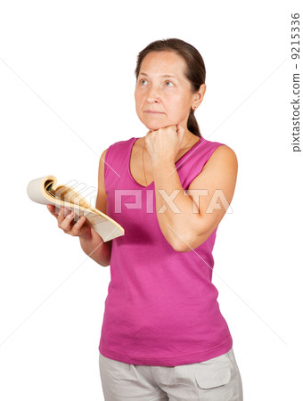 thoughtful mature woman with notebook thoughtful mature woman with notebook 9215336