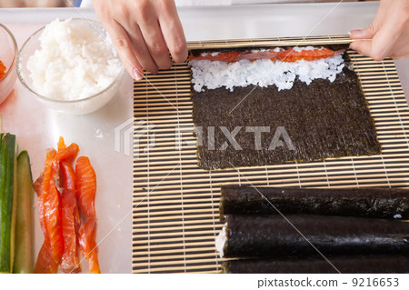 cook making sushi rolls cook making sushi rolls 9216653