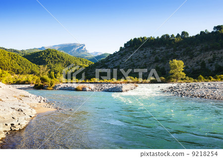 Mountains river with rocky riverside Mountains river with rocky riverside 9218254