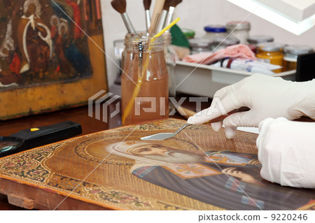 restoration of old icon with palette knife 9220246