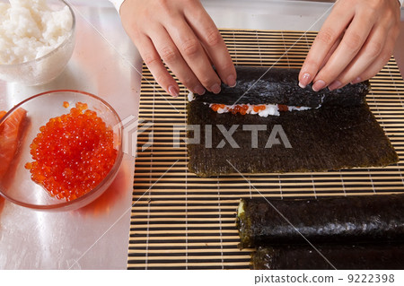 cook making Japanese sushi rolls cook making Japanese sushi rolls 9222398