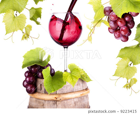 grapes and wine glass on a wooden vintage barrel grapes and wine glass on a wooden vintage barrel 9223415