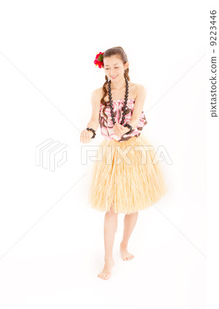 A cute Japanese woman making a characteristic pose of hula dance A cute Japanese woman making a characteristic pose of hula dance 9223446