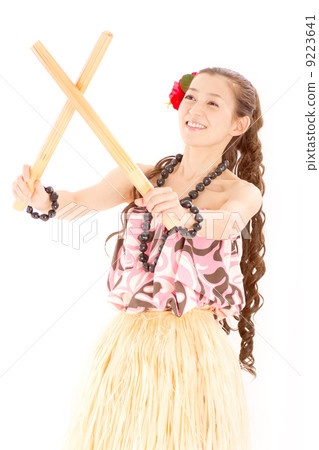 A girl with a smile who poses with crossing the Hawaiian folk musical instrument Buri A girl with a smile who poses with crossing the Hawaiian folk musical instrument Buri 9223641