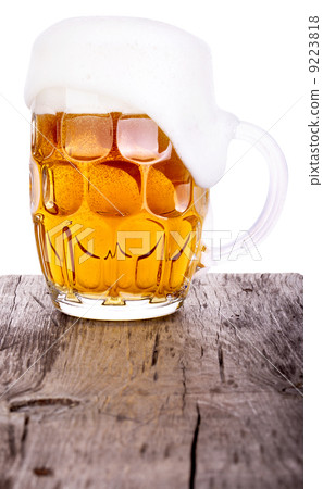 Beer glass on wooden table background 9223818