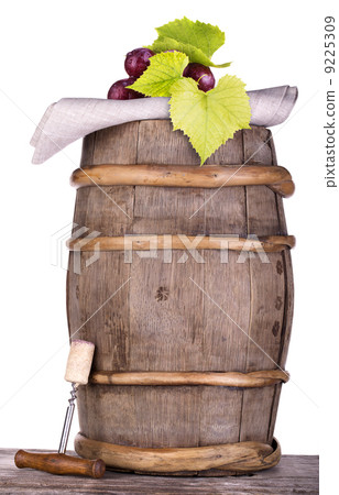 grapes on a wooden vintage barrel with corkscrew 9225309