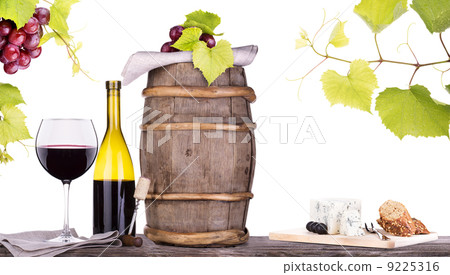 grapes on a barrel with corkscrew and wine glass grapes on a barrel with corkscrew and wine glass 9225316