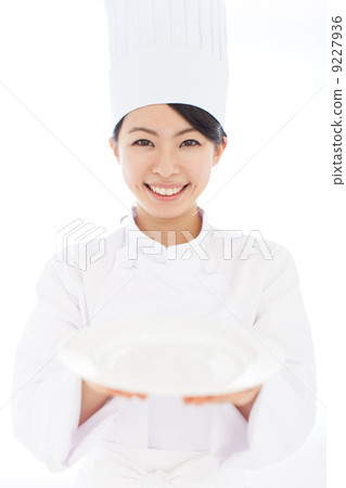 A woman holding a dish A woman holding a dish 9227936