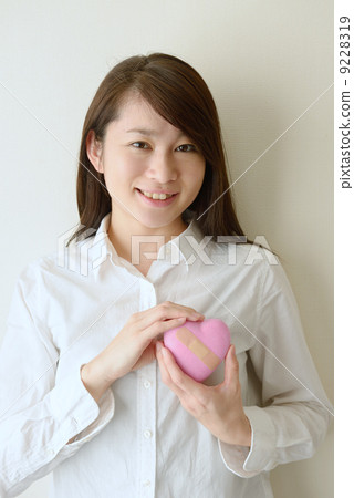 A young woman who recovers from a mental illness and smiles 9228319