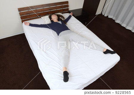 A young lady sleeping in a large letter 9228565