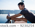 Young Asian Man Stretching Before Exercise 9230254