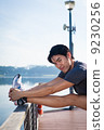 Young Asian Man Stretching Before Exercise 9230256